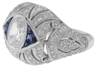 Platinum antique style oval diamond and sapphire ring