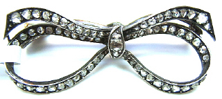 Silver on gold rose cut diamond bow pin