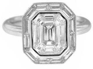 18kt white gold invisible set baguette and emerald cut diamond ring.