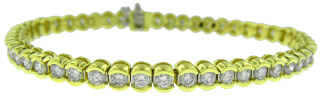18kt yellow gold half-bezel set diamond tennis bracelet 7 1/8"