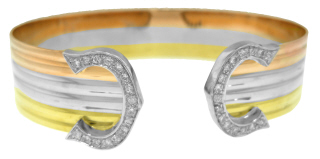 18kt tri-color cuff bangle bracelet with diamond ends.