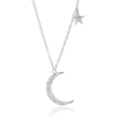 14kt white gold moon and star diamond necklace.