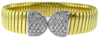 18kt two-tone flexible cuff bangle bracelet with pave diamond ends.