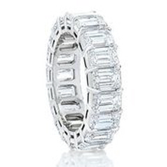 Platinum shared prong emerald cut diamond eternity band with airline.