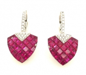 18kt white gold ruby and diamond hanging earrings.