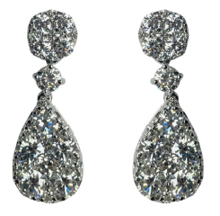 18kt white gold cushion and pear shape illusion cluster hanging earrings.