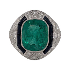 Platinum emerald, black onyx and diamond ring.