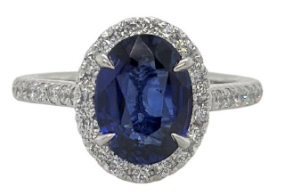 Platinum oval sapphire diamond halo ring