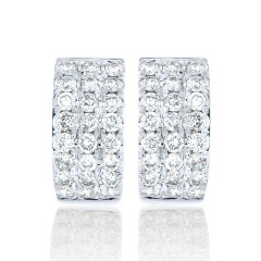 14kt white gold small triple row diamond huggie earrings.