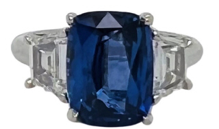 Platinum cushion sapphire and traps diamond ring