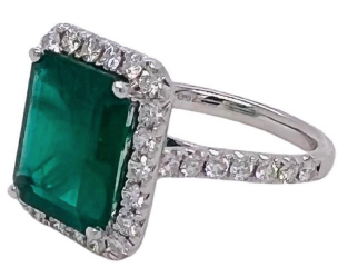 18kt white gold Emerald and diamond halo ring