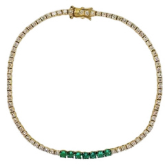 18kt yellow gold emerald and diamond 4-prong tennis bracelet.