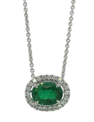 18kt white gold oval emerald and diamond pendant with chain.