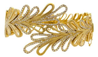 14kt yellow gold wide design diamond bangle bracelet.