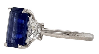 18kt white gold emerald cut sapphire and traps diamond ring