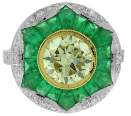 Platinum/18kt yellow gold emerald and diamond ring.